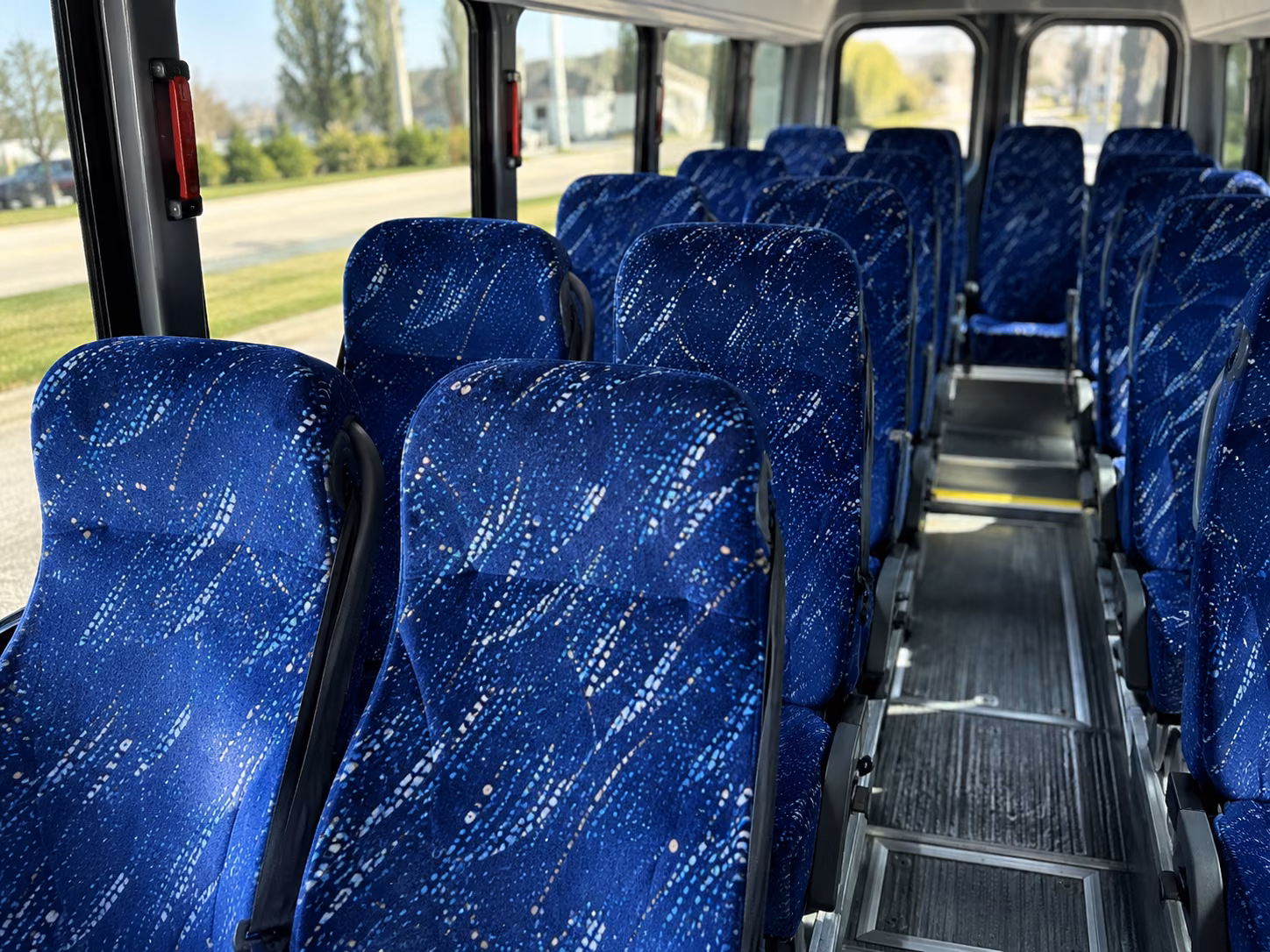 orange 20 passenger minibus inside