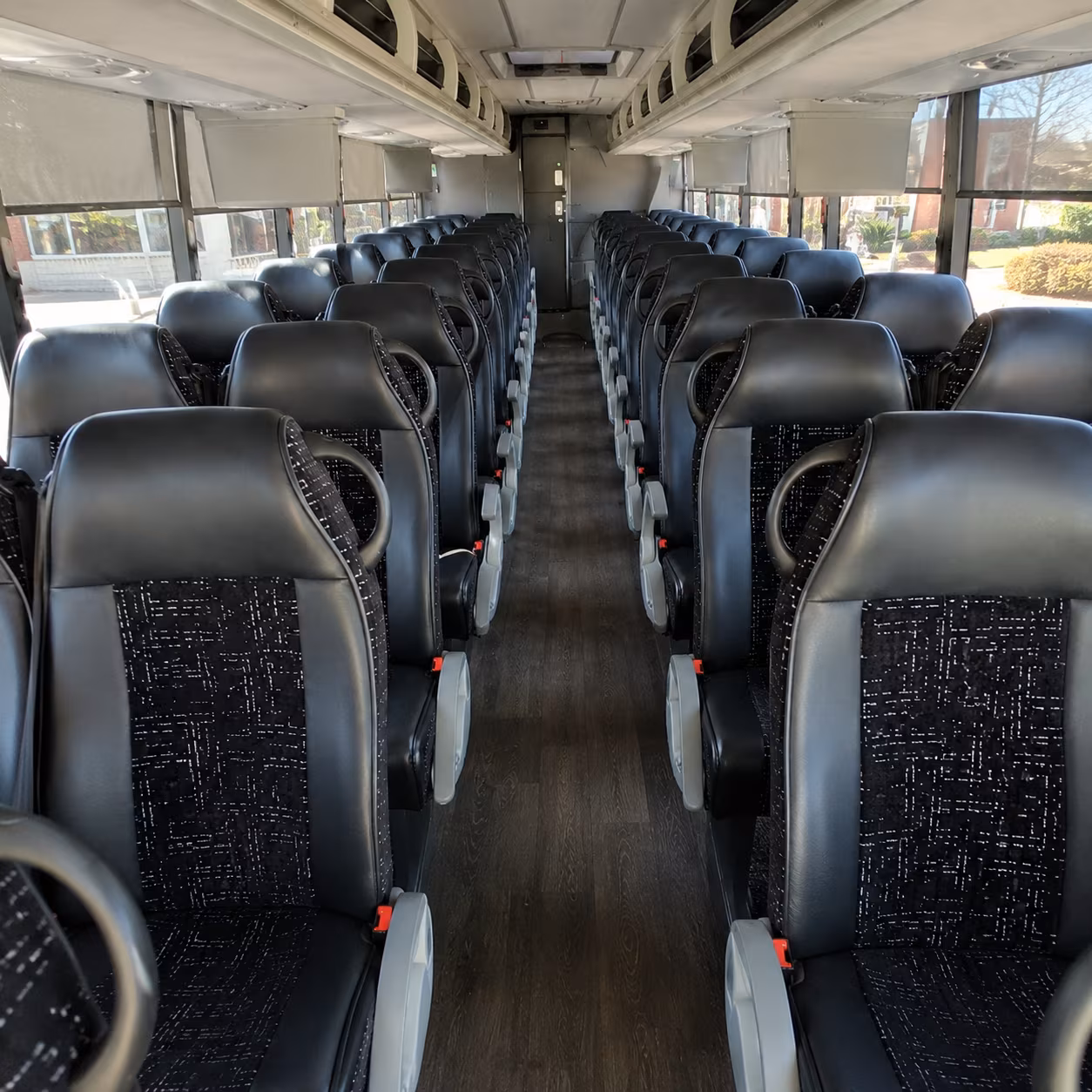 orange 54 passenger charter bus inside