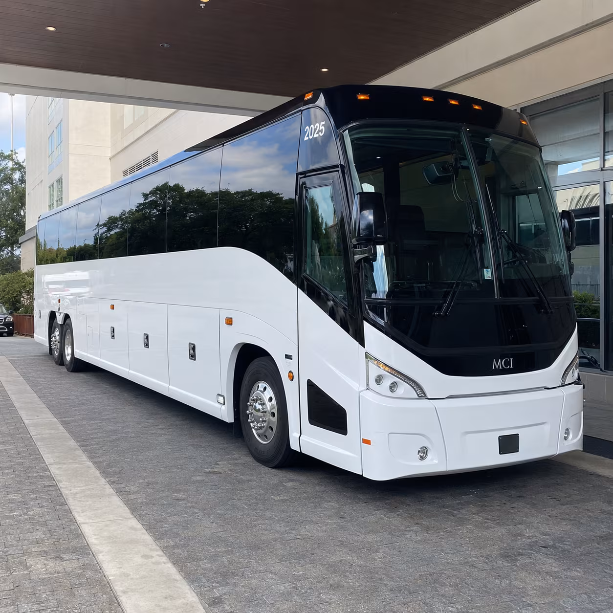 orange 54 passenger charter bus